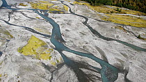 Aerial tracking shot of glacial river delta, Jostedalen National Park, Vestland county, Norway.