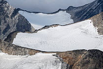 Mount Vestre Memurutindan valley glaciers covered by in thin layer of snow in late summer, Jotunheimen National Park, Norway. August, 2019.