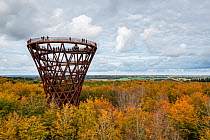Aerial photograph of 45m high forest tower with viewing platform 140m above sea level with view of forest and fields, within Common beech (Fagus sylvatica) forest.  Camp Adventure, Denmark.  non-ex.