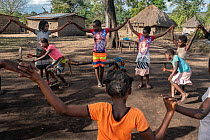 Group of girls participating in group activity at 'Girl's Club' in the village of Samora Rachel, Gorongosa National Park, Mozambique. June, 2018.