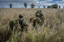 Four female park rangers on patrol, part of an all female ranger patrol, Gorongosa National Park, Mozambique. June, 2018.