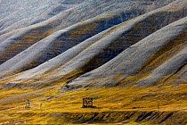 Mountain landscape with remnants of transport system for coal.  Svalbard, Norway. August.