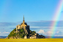 View of Mont Saint-Michel with rainbow in background.  Manche, Normandy, France. June.
