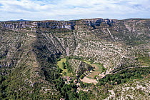 Aerial view of Cirque de Navacelles, a large eroded landform.  Herault, Occitanie, France. May.