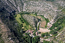 Aerial view of Cirque de Navacelles, a large eroded landform.  Herault, Occitanie, France. May.