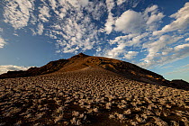 Blue sky and clouds over volcanic landscape, Bartolome Island, Galapagos National Park, Galapagos Islands. June, 2019.