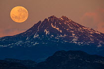 Moonrise over mountain, Torres del Paine National Park, Magallanes, Chile. June, 2022.