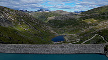 Aerial shot of the biggest Hydroelectric stone dam in Norway, Storglomvatnet Reservoir, Norway.