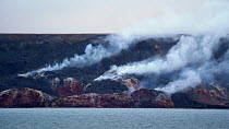 Sulphurous gas rising after spontaneous ignition of underground subterranean oil shales, Smoking Hills, Inuvik, Northwest Territories Canada, September, 2022.