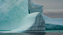 Tracking shot of an iceberg, Pond Inlet, Qikiqtaaluk Region, Nunavut, Canada.
