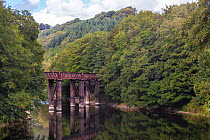 Redbrook Bridge, originally railway bridge now used as footbridge, marking Welsh and English border on River Wye.  Monmouthshire, Wales, UK. September.