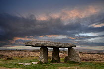 Lanyon Quoit, a Neolithic dolmen / tomb, under a stormy sky, Madron near St Just, Cornwall, England, UK. March, 2022.