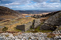 Abandoned slate mine workings high above the village of Capel Curig, Snowdonia National Park, Wales, UK. March, 2022.