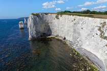 White chalk cliffs of Handfast Point and the Pinnacles, Studland Bay, Dorset, UK. July, 2022.