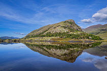 Eagles Nest mountain reflecting in Upper Lake, Killarney National Park, County Kerry, Republic of Ireland. September, 2022.