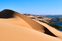 View over Sandwich Harbour, RAMSAR site from a high sand dune, Namib Desert, Namib Naukluft National Park, Namibia.