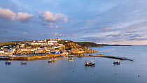 Mevagissey village and fishing harbour at dawn, Cornwall, England, UK. January, 2022.