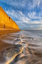 Sandstone cliffs along the beach at Burton Bradstock, Jurassic Coast World Heritage Site, Dorset, England, English Channel, UK. January, 2022.
