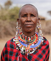 Masai older woman portrait.  Amboseli National Park, Kenya. July.