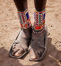 Masai ankle decoration close up.  Amboseli National Park, Kenya. July.