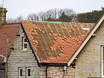 Roof tiles blown off a house roof by Storm Arwen, Bamburgh, Northumberland, UK. January, 2022.