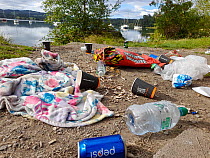 Rubbish left behind by visitors on the shores of Lake Windermere, Ambleside, Lake District, UK. August.