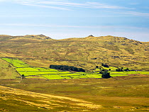 View over farmland and moorland towards Birker Fell from Green Crag, Lake District, Cumbria, UK. August, 2022.