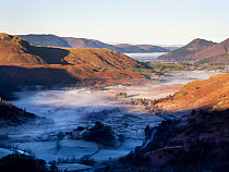 View from the Helvellyn range looking towards Skiddaw with valley mist from a temperature inversion, Lake District, Cumbria, UK. December, 2021.