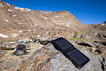 Photographer's campsite equipped with solar panels, during fieldwork on Iberian ibex.  Sierra Nevada National Park, Andalusia, Spain. June.