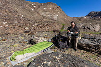 Photographer and his campsite during fieldwork on Iberian ibex in Siete Lagunas.  Sierra Nevada National Park, Andalusia, Spain. July.