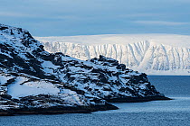 Island in the Laksefjorden, with the Svaerholt-peninsula in the background. Lebesby municipality, Finnmark, Norway. February, 2015.