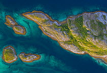 Aerial view of islands, islets and skerries in a wide stretch of strandflat, Rangsundoya, Rodoy, Helgeland, Norway. August, 2019.