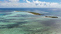 Aerial view of Grand Polyte islet & Petit Polyte islet, Cosmoledo Atoll, Seychelles, Indian Ocean. April, 2023.