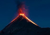 Lava and ash erupting from Fuego Volcano at night, one of the most active volcanoes in Guatemala, viewed from Acatenango Volcano, Guatemala. 3rd March, 2023.