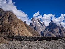 View of Trango Towers cliffs under low cloud, Baltoro Glacier, Karakoram Mountains, Gilgit-Baltistan, Northern Pakistan. July, 2022.