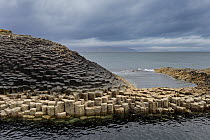 Hexagonal basaltic rock formations formed by volcanic eruption, Island of Staffa, Inner Hebrides, Scotland, UK, Atlantic Ocean, May 2017.