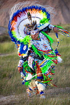 Gerimiah Holy Bull, a member of the Sioux Rosebud Tribe of Native Americans, wearing traditional dress performing a 'Fancy Dance', South Dakota, USA. June, 2022.