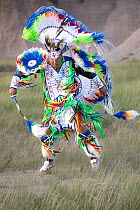 Gerimiah Holy Bull, a member of the Sioux Rosebud Tribe of Native Americans, wearing traditional dress performing a 'Fancy Dance', South Dakota, USA. June, 2022.