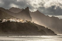 Bajamar in evening light with misty mountains behind, Tenerife, Canary Islands, Atlantic Ocean. March, 2022.