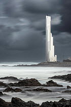 Punta del Hidalgo lighthouse under grey clouds, Tenerife, Canary Islands, Atlantic Ocean. March, 2022.