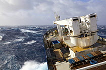 'Marion Dufresne II' ship (TAAF supply and oceanographic vessel) in a force 10-11 storm in the Roaring Forties between Crozet and Kerguelen Island, Indian Ocean. April, 2018.