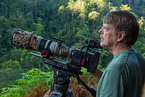 Photographer Tim Laman with RED Digital Cinema, waiting to film hornbills, Halabala Wildlife Sanctuary, Narathiwat, Thailand. March, 2017.