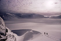 Two scientists from the British Antartic Survey walking across the Sunshine Glacier, Coronation Island, South Orkneys Antarctica.