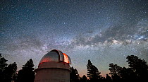 The Hall 42 inch telescope at Lowell Observatory at night, in a designated dark sky area, with the Milky Way in sky above, Anderson Mesa Dark Sky Site, Arizona, USA. April, 2022.