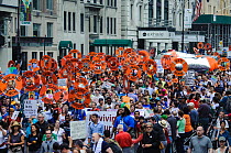 Huge crowd of demonstrators from affected shoreline communities marching along 59th Street during the People's Climate March which jammed 6th Avenue and 42nd street through Times Square, New York City...