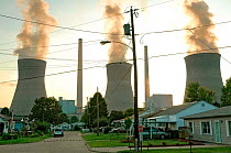 The John Amos coal-fired power plant looming over a residential neighborhood, Poca, West Virginia, USA. September, 2005.