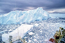 Muller Ice Shelf with debris from its disintegrating edge, seen from bridge of Reasearch vessel Nathaniel Palmer, during Eugene Domack study of warming regional climate, Antarctic Peninsula. April, 19...