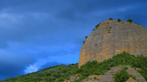 Timelapse of clouds moving over rocky outcrop in Iregua Valley, Sierra Cebollera Natural Park, La Rioja, Spain. August.