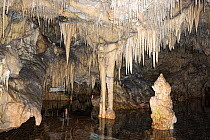 View inside the Diros Caves, with underground river, stalagmites and stalactites in limestone, south of Areopolis, Mani, Peloponnese, Greece. March, 2015.
