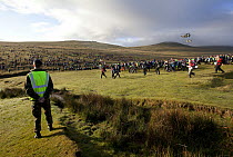 Crowds participating in Ten Tors walk with helicopters overhead, Dartmoor, Devon, England, UK. May, 2011.
